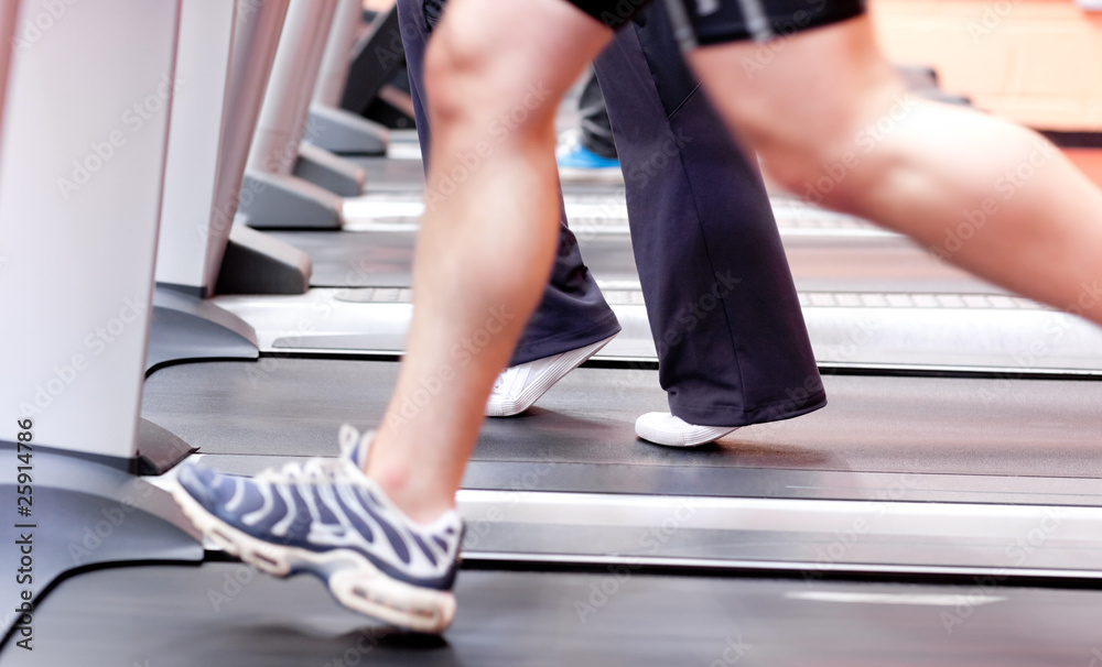 Close-up of the legs of an athletic young man exercising on a