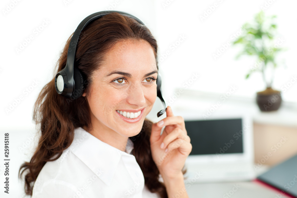 Smiling woman with headset working in a call center Smiling woman with headset working in a call center