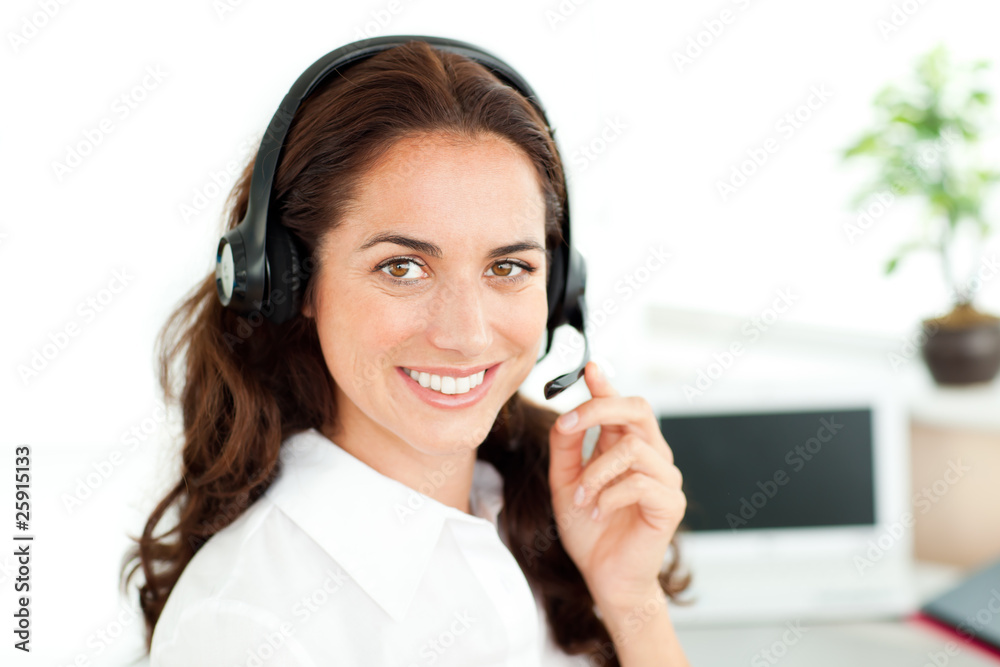 Smiling woman looking at the camera wearing a headset Smiling woman looking at the camera wearing a headset
