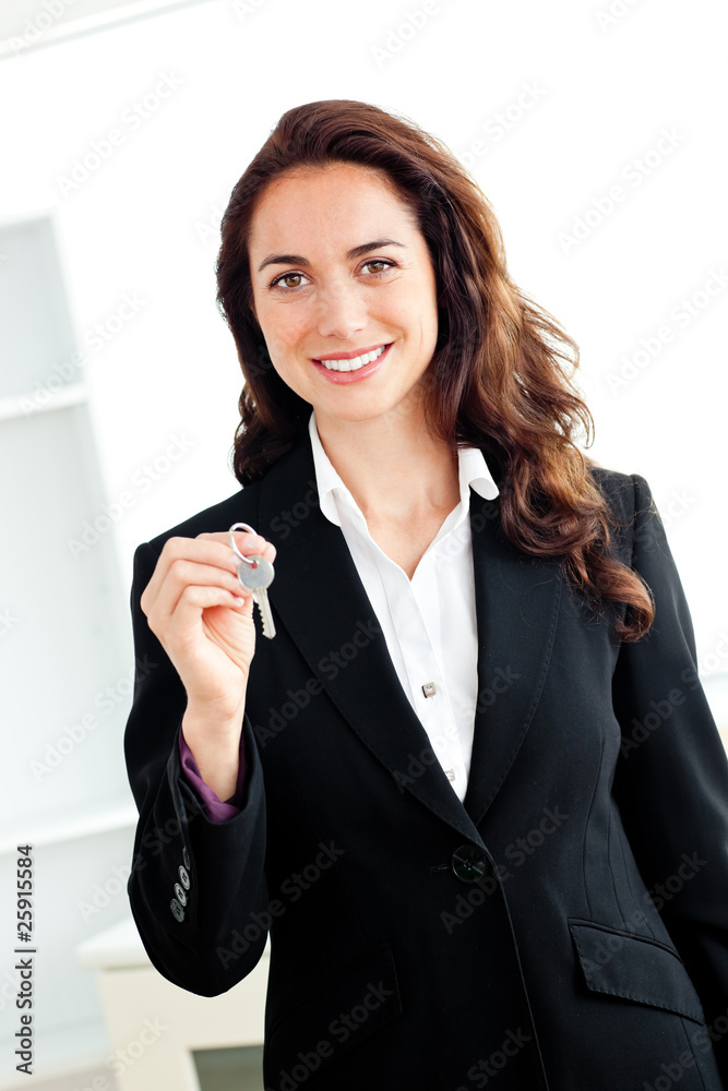 Portrait of a caucasian businesswoman holding a key Portrait of a caucasian businesswoman holding a key
