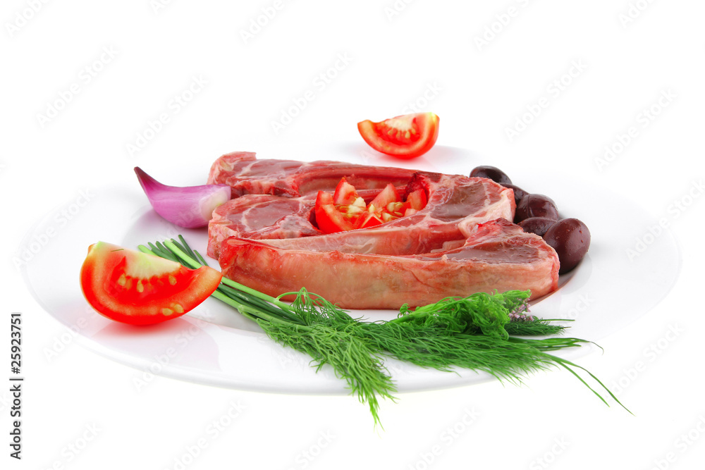 fresh raw ribs on plate