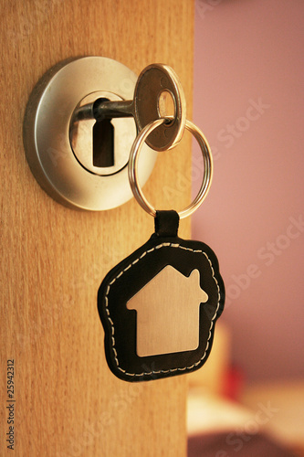 A key in a lock with house icon on it