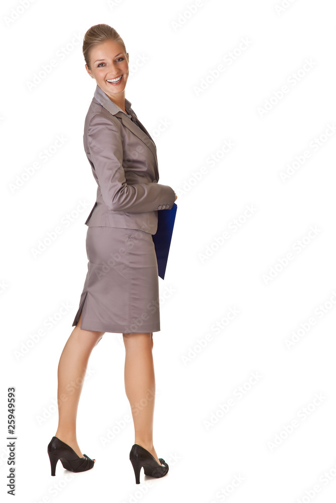 Caucasian blond businesswoman in suit holding ring binder on whi Caucasian blond businesswoman in suit holding ring binder on whi