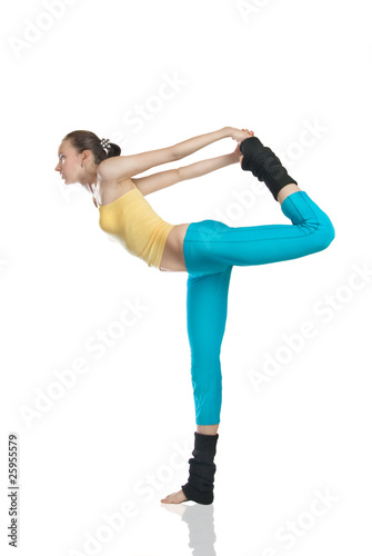 attractive woman doing gymnastics on white background