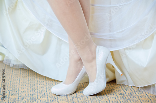 closeup photo of beautiful bride's shoes