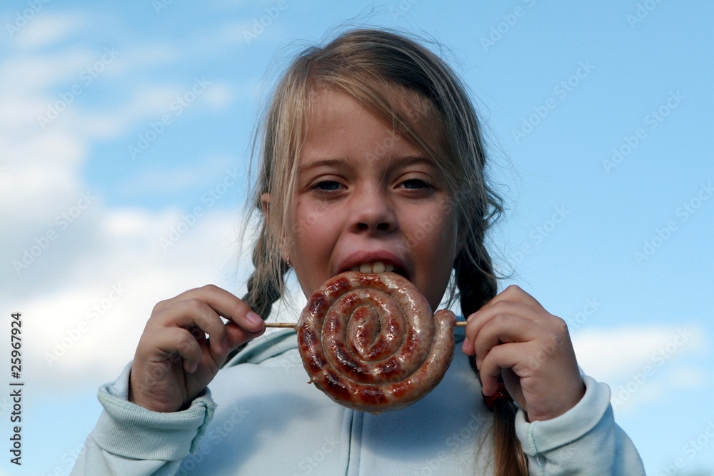 Girl going to eat rolled smoked sausage Girl going to eat rolled smoked sausage
