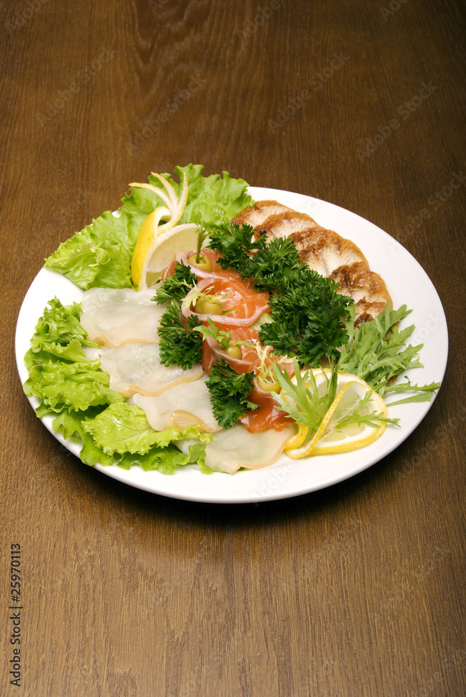 Appetizer made of meat and fish served Appetizer made of meat and fish served
