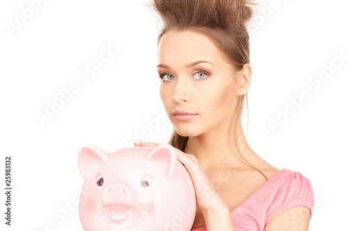 lovely woman with piggy bank