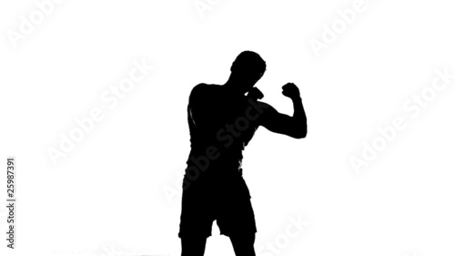 Silhouette of Man Shadowboxing photo