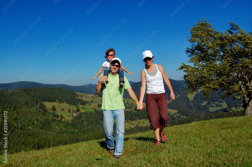 Family of three on their vacation in mountains Family of three on their vacation in mountains