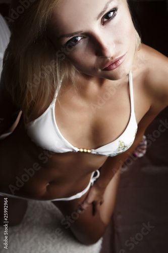 Sexy stunning blond beauty in a romantic pose