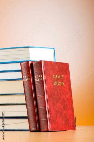 Bible books against the colorful gradient background photo