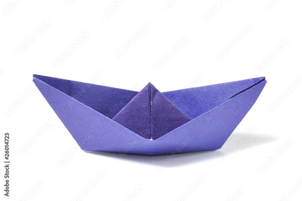 Close up origami ship over white Close up origami ship over white