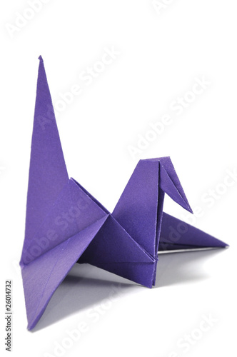 Origami crane over white