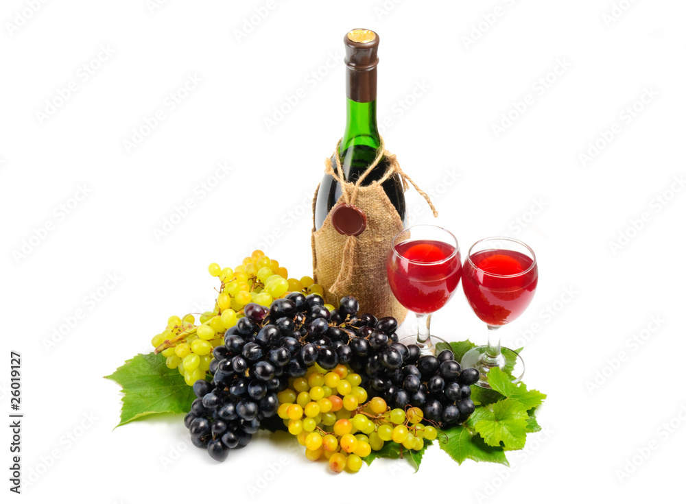 Arrangement of grapes with a bottle of wine and glasses