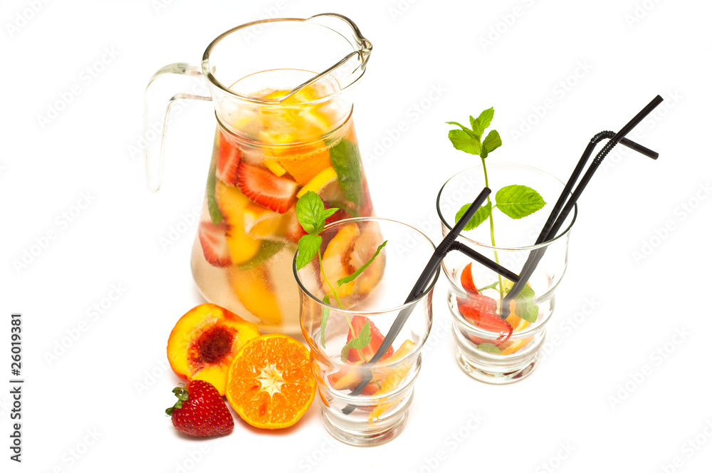 Fototapeta premium refreshing fruit cocktail isolated on white