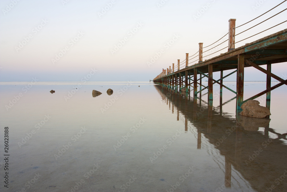 bridge stretching out into vast ocean bridge stretching out into vast ocean