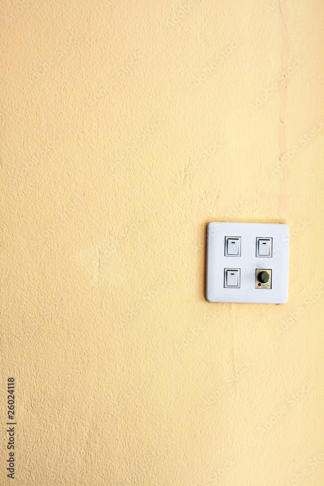 four switch on a yellow wall four switch on a yellow wall