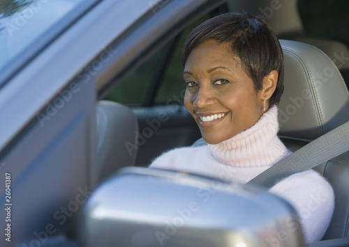 African woman driving car photo