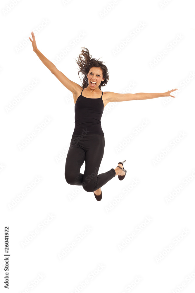 Cute young energetic girl wearing black jumping in air