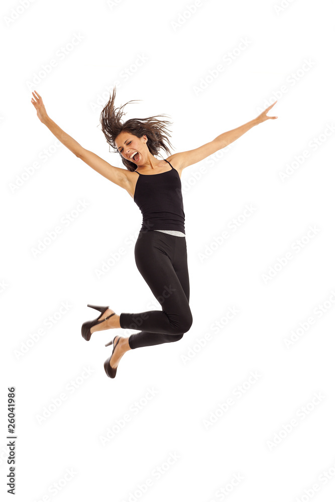 Cute young energetic girl wearing black jumping in air