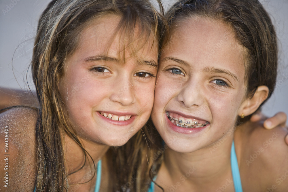 © Kikor/Blend Images - Close up of smiling Hispanic girls