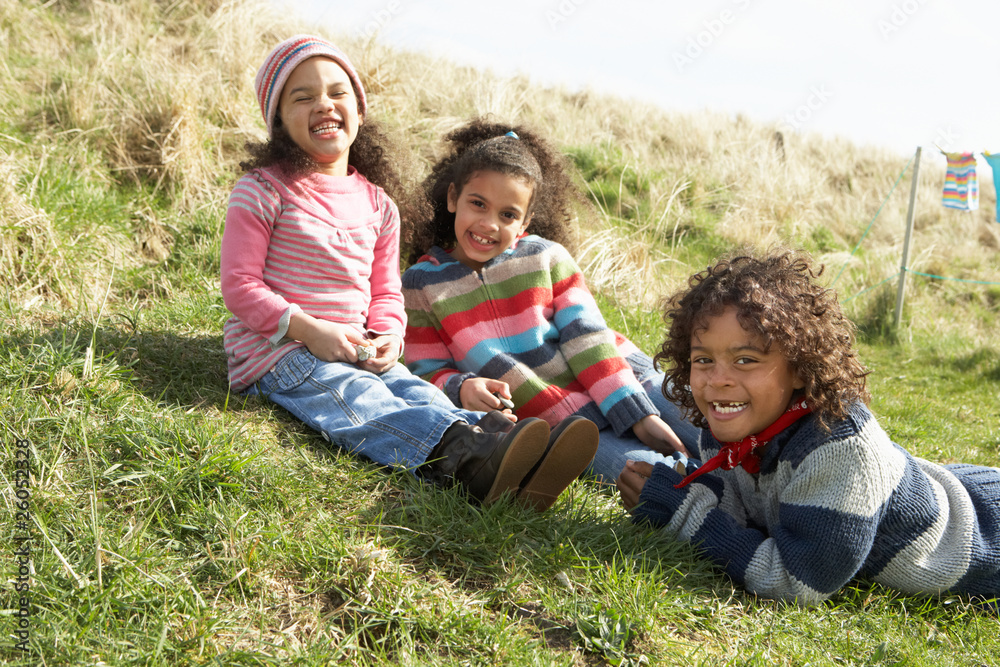 Young Children Sitting Outside In Caravan Park Young Children Sitting Outside In Caravan Park