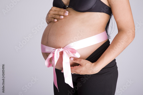 Wallpaper Mural pregnant belly with pink bow over it Torontodigital.ca