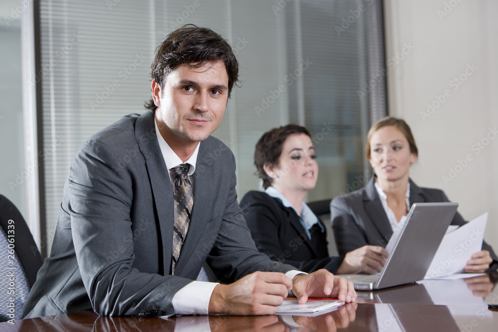 Businessman in boardroom with female colleagues Businessman in boardroom with female colleagues