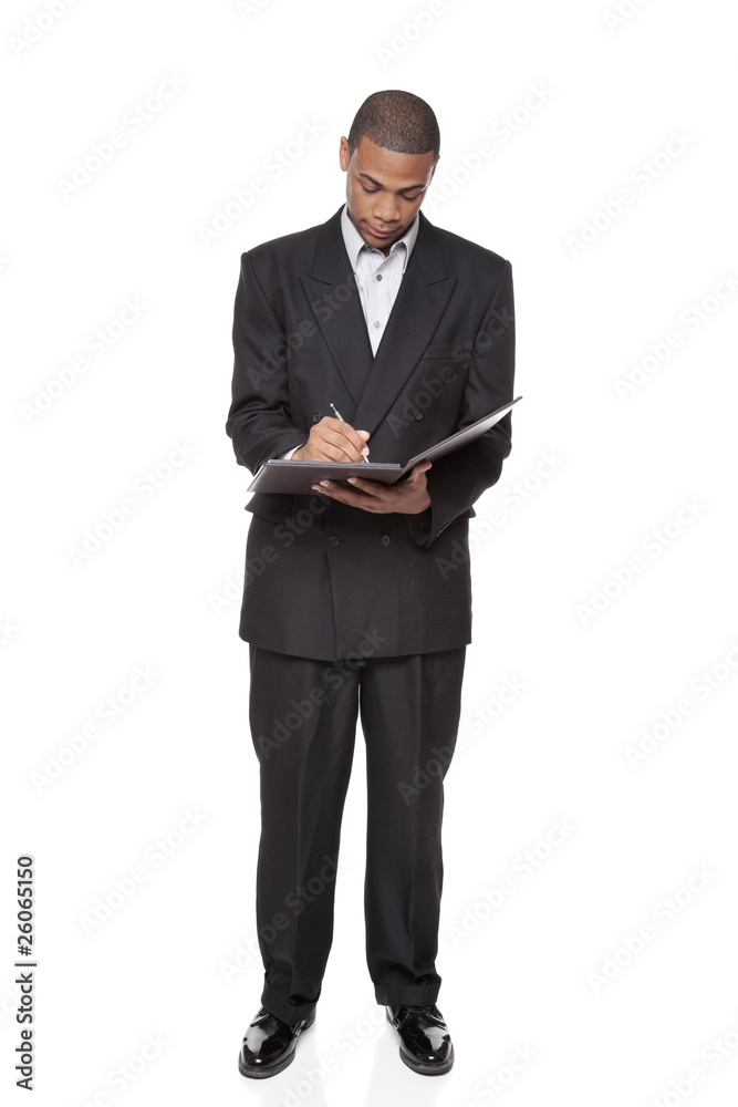 African American businessman isolated on white writing notepad African American businessman isolated on white writing notepad