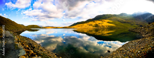 Beautiful wide view of welsh mountain range with blue lake and s
