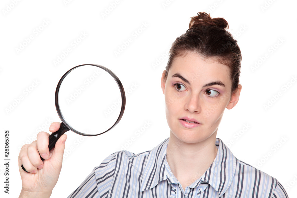 closeup of woman searching with magifying glass closeup of woman searching with magifying glass
