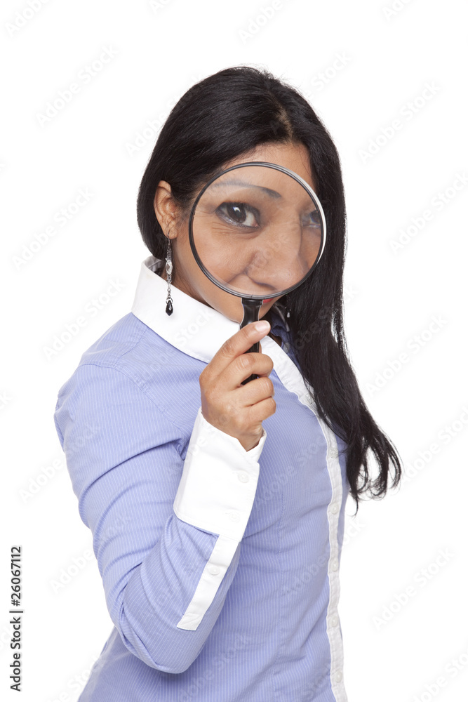 Businesswoman - Latina searching with magnifying glass
