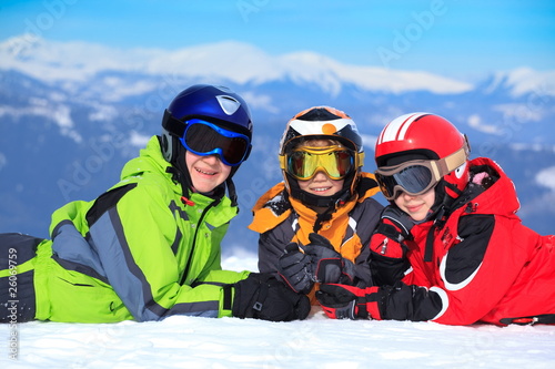 Kids in snow on mountaintop