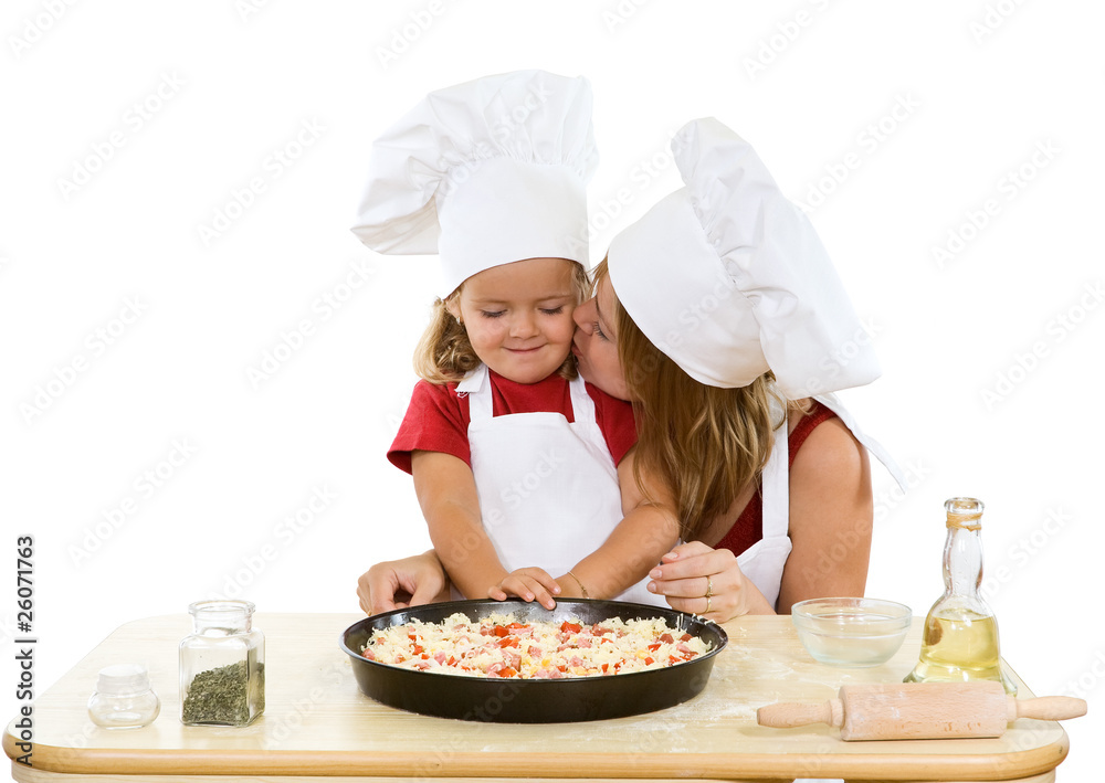 Woman and little girl making pizza Woman and little girl making pizza