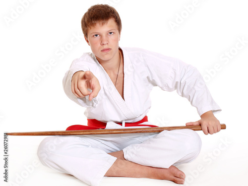 Teenage in kimono with wooden sword