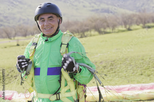 Senior Hispanic man skydiving photo