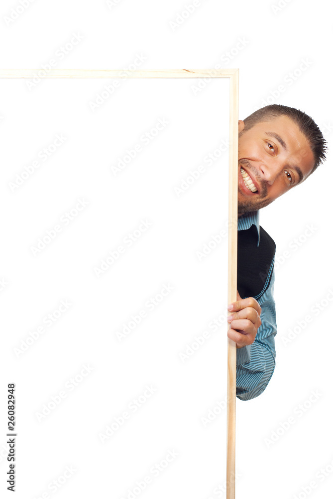 Businessman hiding behind banner Businessman hiding behind banner