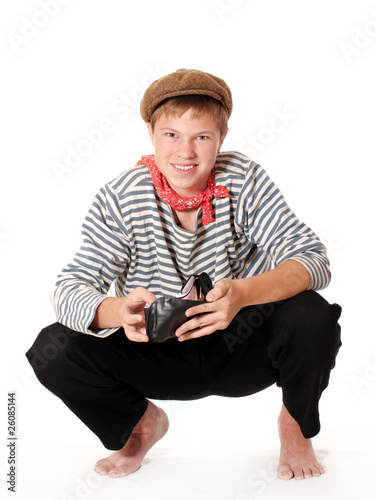 Teenage dressed in seaman shirt playing with wallet
