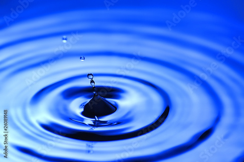 Splash and droplet with water ripples