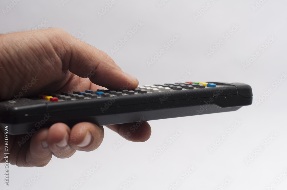 Hand holding a remote isolated on white Hand holding a remote isolated on white
