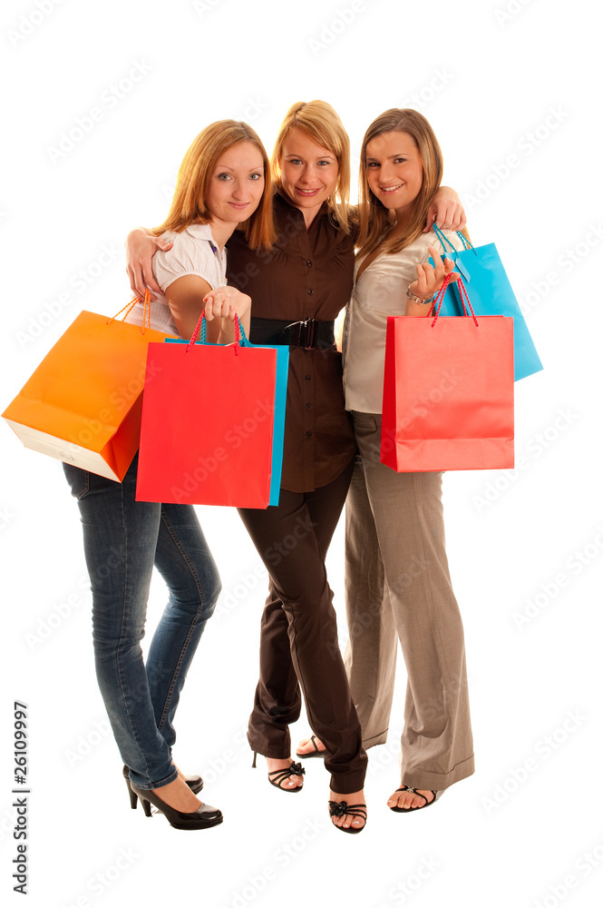 Three cute girls with shoping bags isolated