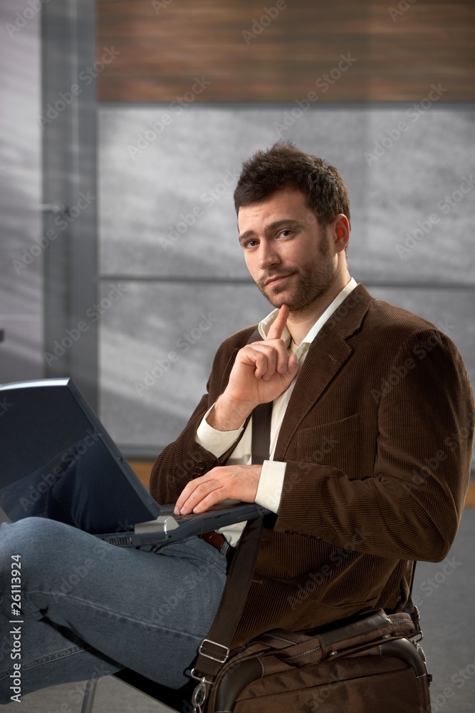 Portrait of man with laptop Portrait of man with laptop