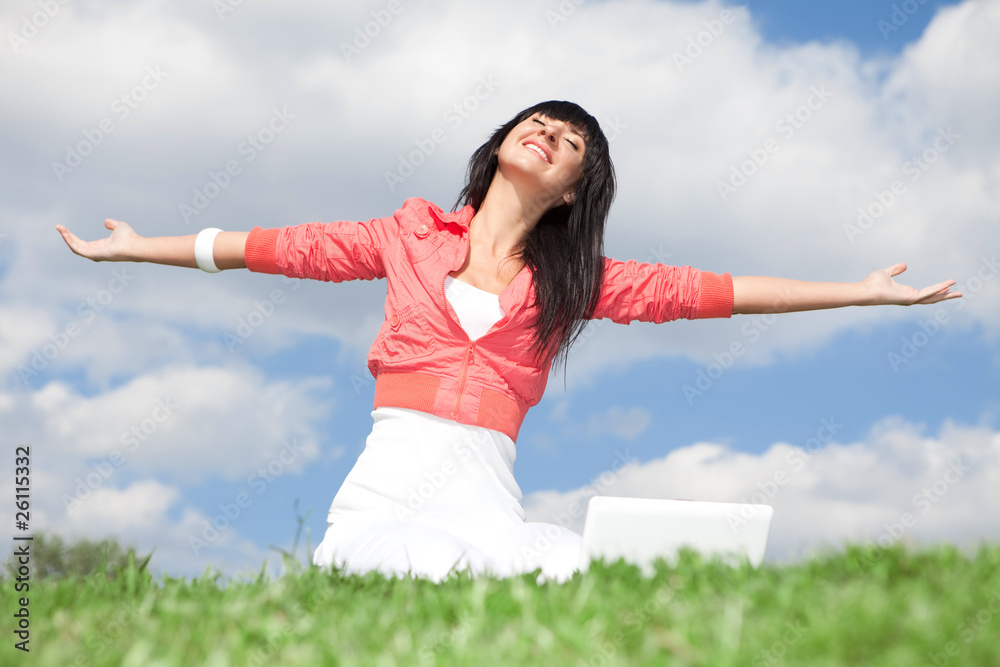 Cute woman with white laptop in the park Cute woman with white laptop in the park