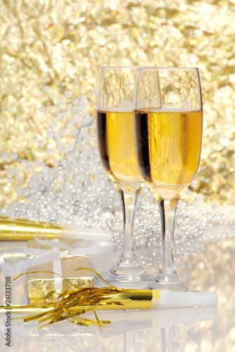 two glasses champagne with gift and horns