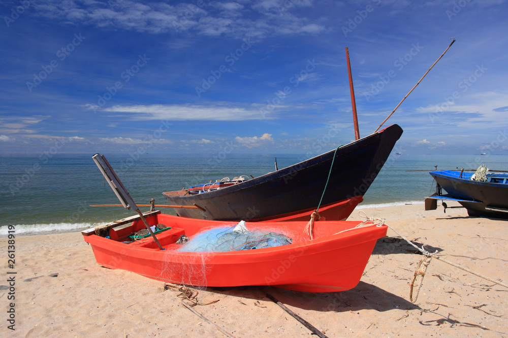 Red Small fishing boats on the beach. Red Small fishing boats on the beach.