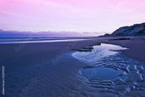 Fairlight Cove peaceful beach at sunset photo