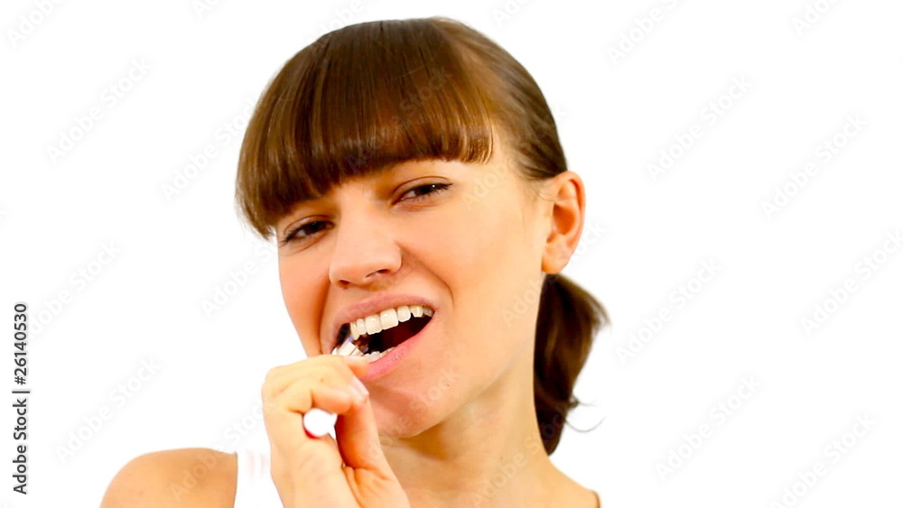 Woman brushing her teeth, isolated Woman brushing her teeth, isolated