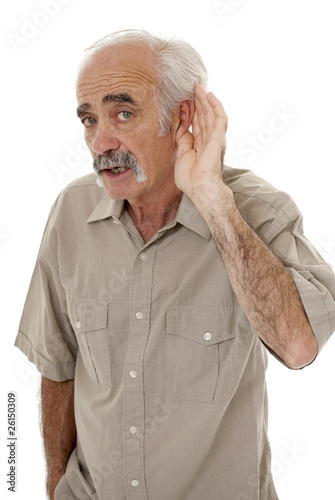 Man cupping his ear having difficulty hearing