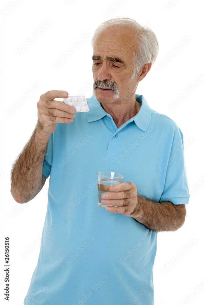 Elderly man reading instructions of pill packet Elderly man reading instructions of pill packet